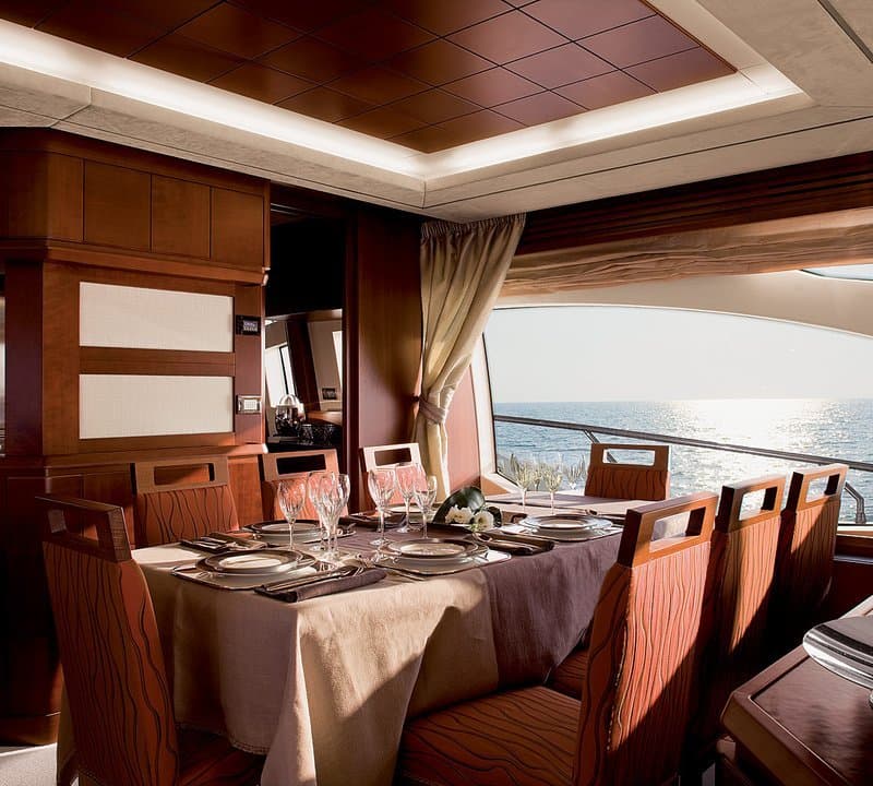 Formal dining salon aboard ANDREIKA 95ft Azimut yacht charter in Cabo San Lucas