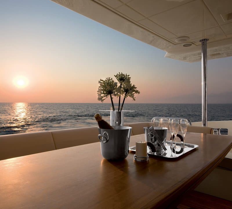 Sunset dining on the aft deck of ANDREIKA 95ft yacht charter in Cabo San Lucas